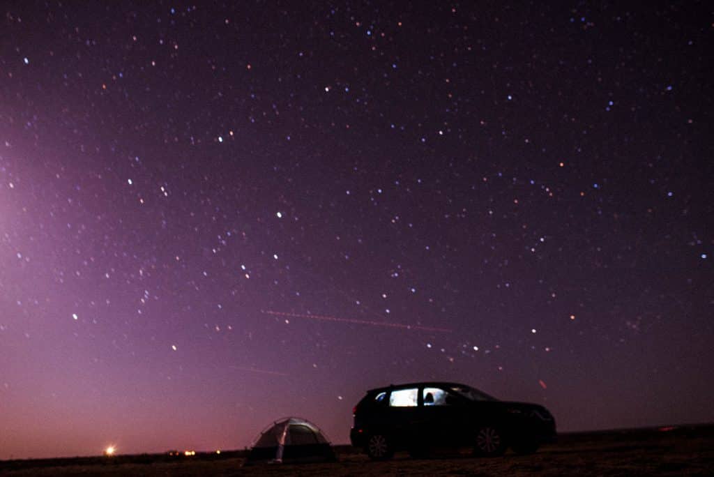 Our 2-person tent against the backdrop of a beautifully lit night sky in Williams, Arizona