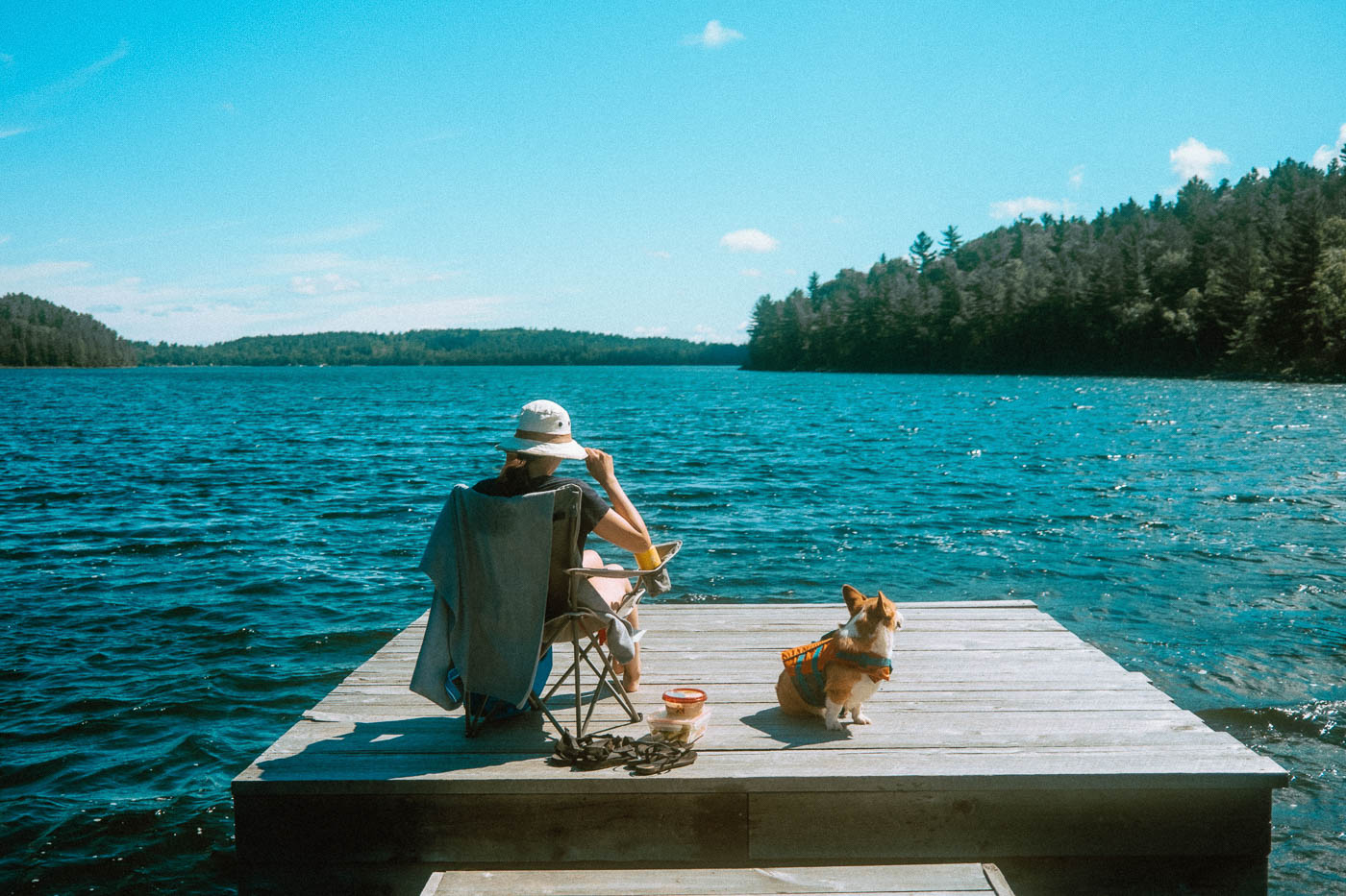 Woman and Dog enjoying the deck at Pine Falls Lodge