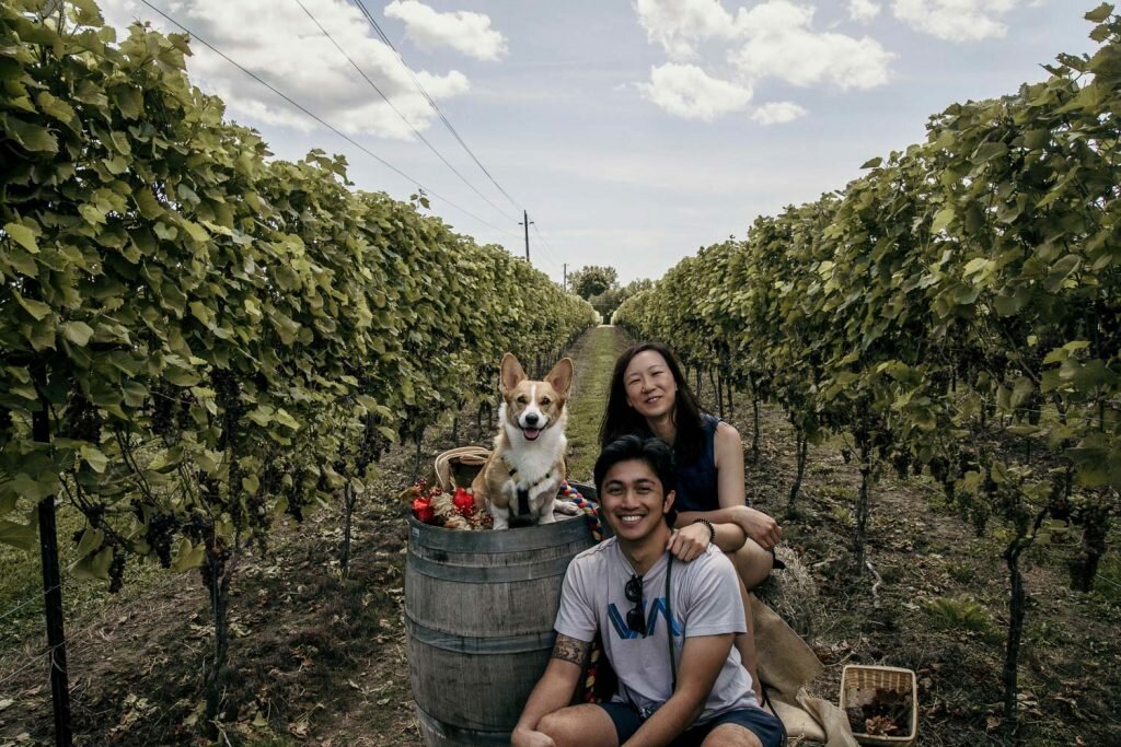 Maria, Limone, and Angelo from SYDE Road posing at the Top Dog Photoshoot even held at the dog-friendly Hounds of Erie Winery in the Norfolk County