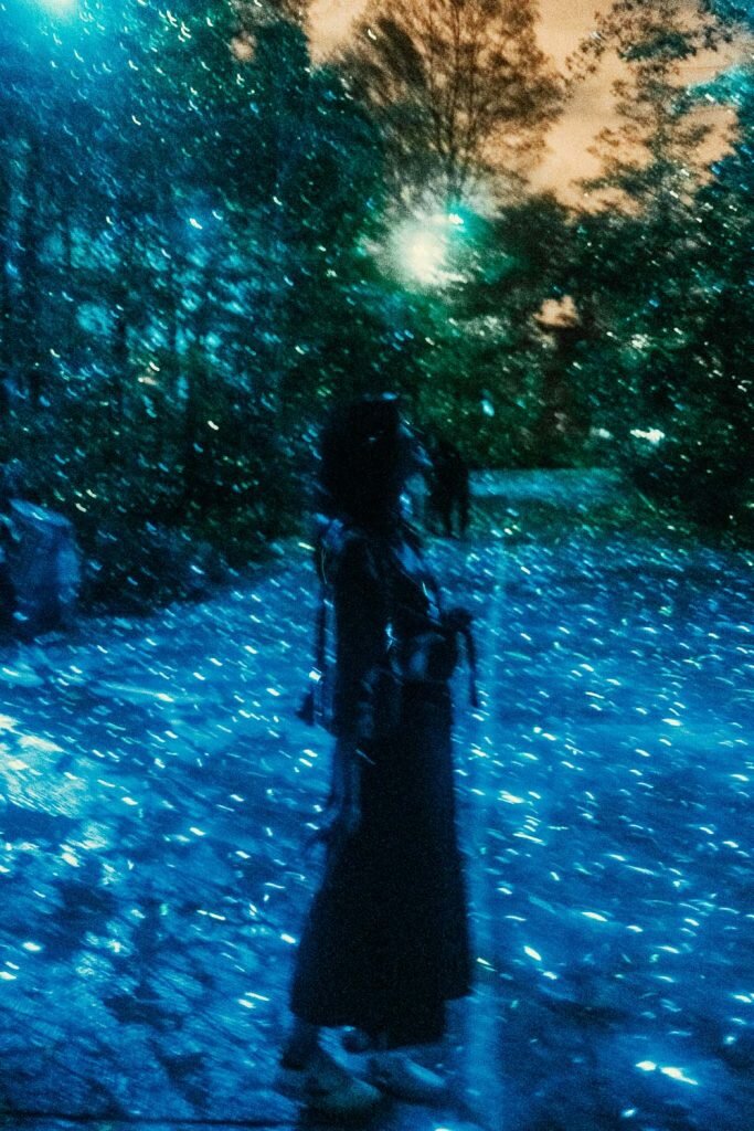 Maria from SYDE Road standing in the Luminou Forest taken at the dusk. Terra Lumina at the Toronto Zoo